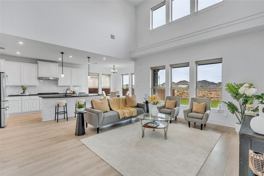 A lofty living area flows seamlessly into a well-appointed kitchen, ideal for entertaining.