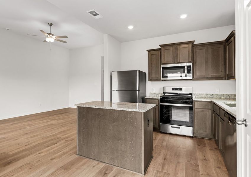 The kitchen has a convenient kitchen island. The kitchen has a convenient kitchen island.