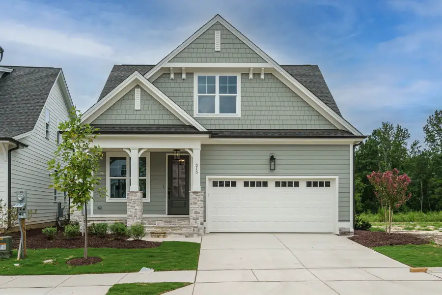 Front exterior of a new home in Wendell Falls, Wendell, NC, highlighting curb appeal (Image 2). Front exterior of a new home in Wendell Falls, Wendell, NC, highlighting curb appeal (Image 2).