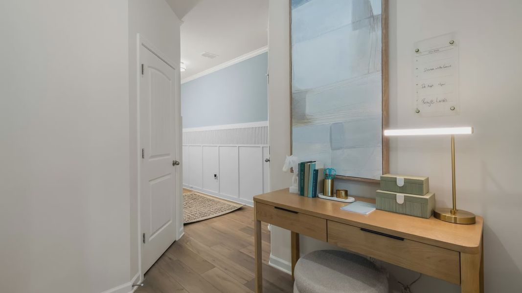 Stylish foyer entry in new construction townhome featuring decorative trim and contemporary finishes.