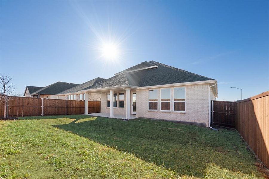 Exterior details and patio area of a home in Wildflower Ranch, Justin (Image 24).