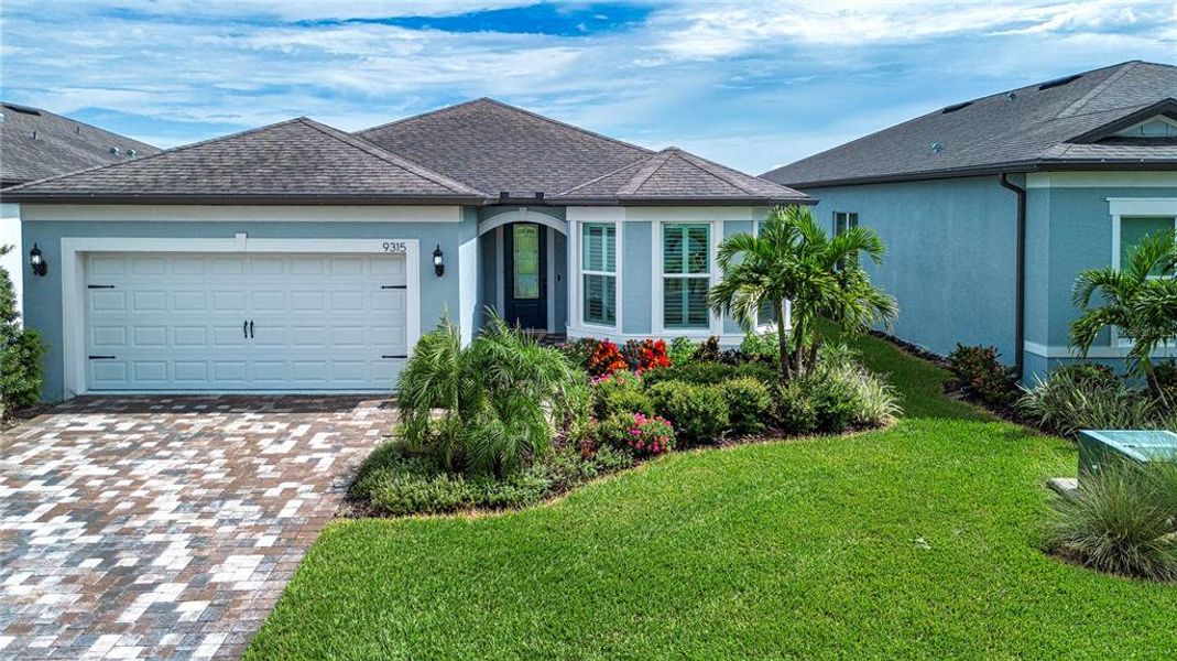 Front exterior of a new home in , Parrish, FL, highlighting curb appeal (Image 2).