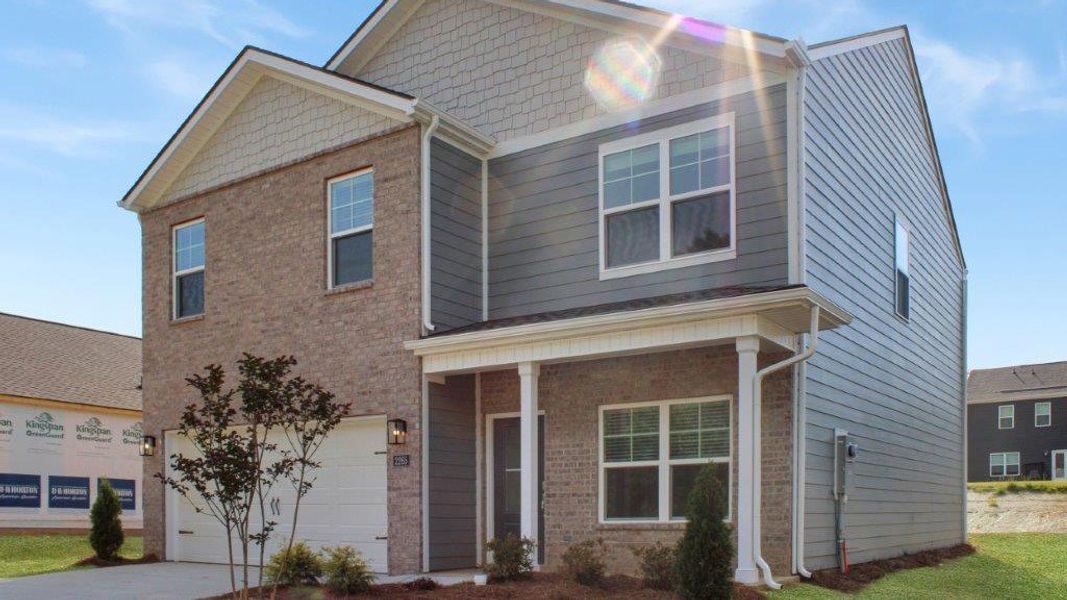 Front exterior of a new home in Fairview Hills, Cleveland, TN, highlighting curb appeal (Image 2).