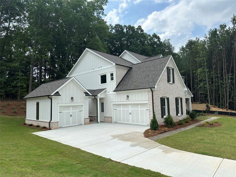 Front exterior of a new home in Lanesborough, Marietta, GA, highlighting curb appeal (Image 2). Front exterior of a new home in Lanesborough, Marietta, GA, highlighting curb appeal (Image 2).