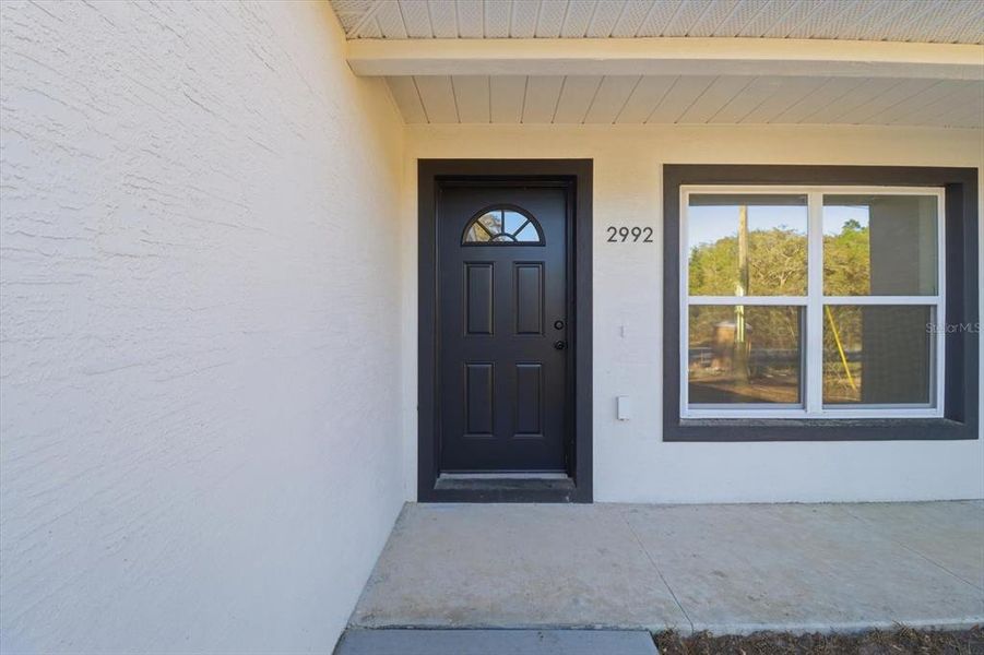 Exterior details and patio area of a home in , Citrus Springs (Image 25).