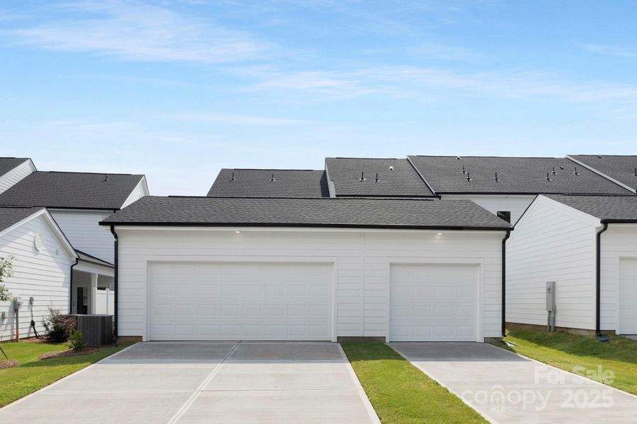 Front exterior of a new home in Edgewood Preserve, Huntersville, NC, highlighting curb appeal (Image 21). Front exterior of a new home in Edgewood Preserve, Huntersville, NC, highlighting curb appeal (Image 21).