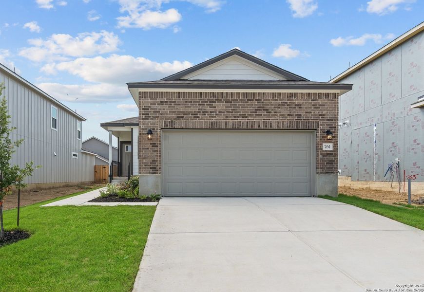 Front exterior of a new home in Highland Ridge, New Braunfels, TX, highlighting curb appeal (Image 19). Front exterior of a new home in Highland Ridge, New Braunfels, TX, highlighting curb appeal (Image 19).