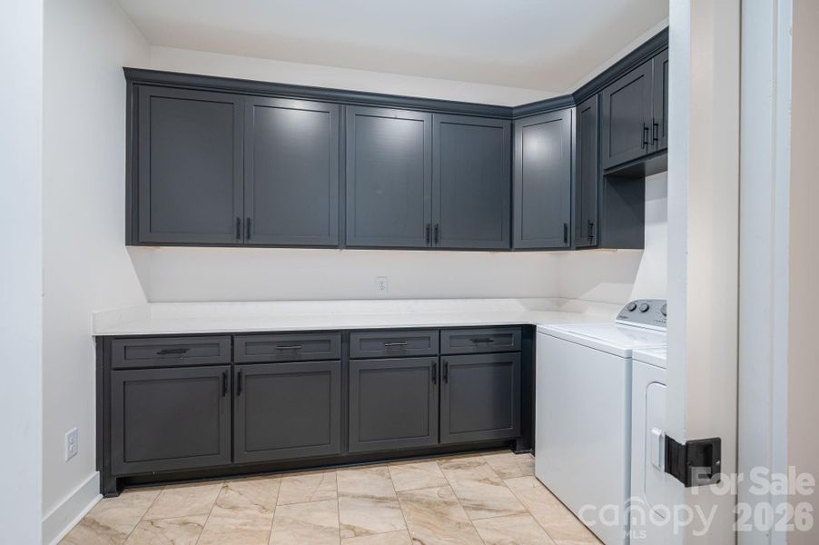 Large laundry room.  Tile floors