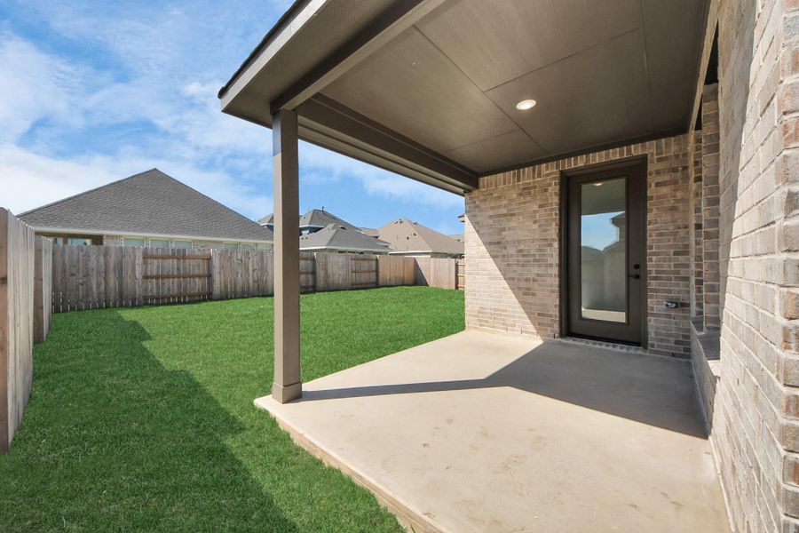 Exterior details and patio area of a home in 50' Traditional Homes at Elyson, Katy (Image 27). Exterior details and patio area of a home in 50' Traditional Homes at Elyson, Katy (Image 27).
