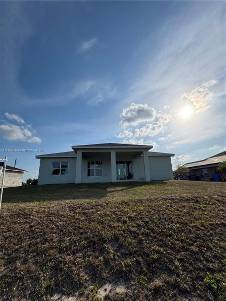 Front exterior of a new home in , Labelle, FL, highlighting curb appeal (Image 13).
