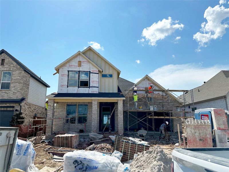 Front exterior of a new home in 50' Traditional Homes at Elyson, Katy, TX, highlighting curb appeal (Image 24). Front exterior of a new home in 50' Traditional Homes at Elyson, Katy, TX, highlighting curb appeal (Image 24).