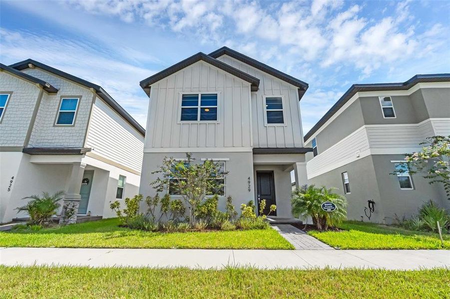 Front exterior of a new home in , St. Cloud, FL, highlighting curb appeal (Image 2).