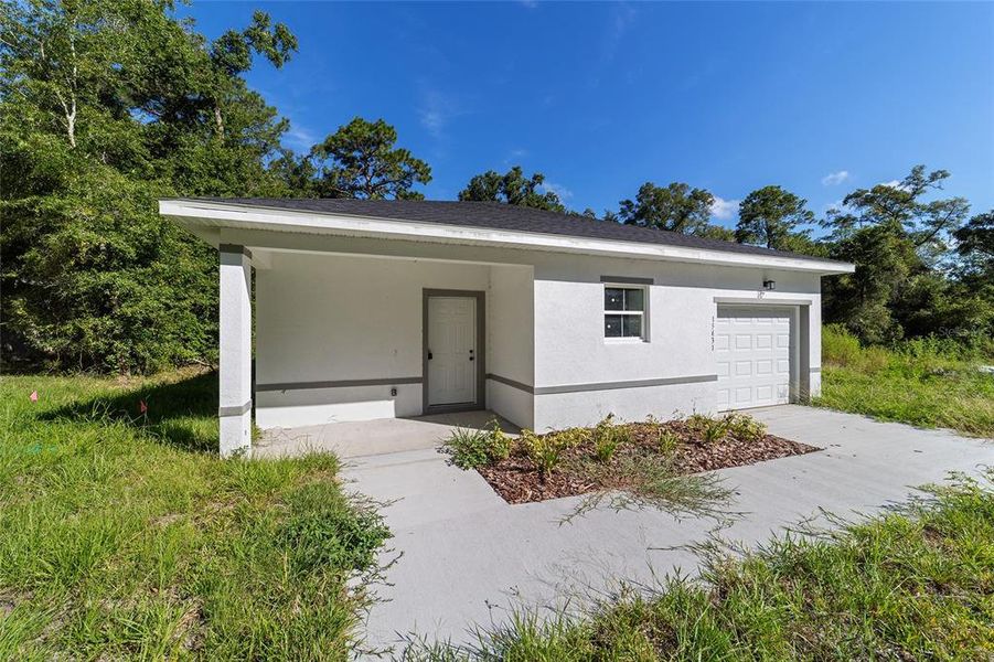 Front exterior of a new home in , Ocala, FL, highlighting curb appeal (Image 20). Front exterior of a new home in , Ocala, FL, highlighting curb appeal (Image 20).