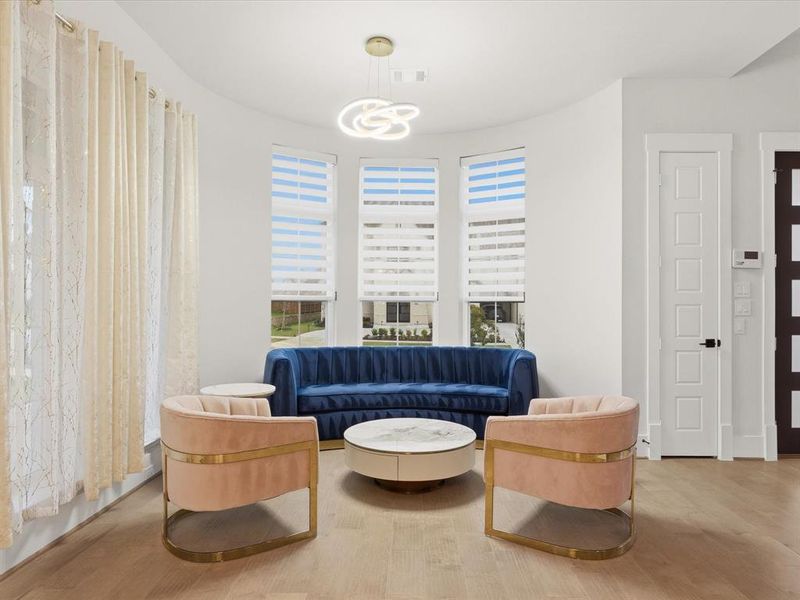 Curved wall with three windows featuring horizontal blinds Curved wall with three windows featuring horizontal blinds