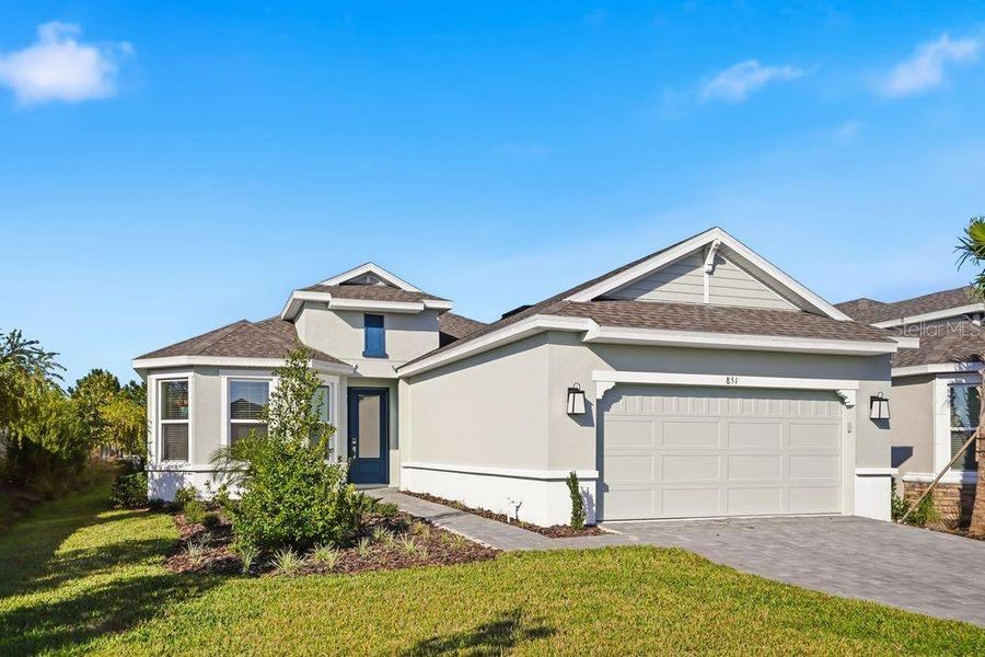 Front exterior of a new home in Esplanade at Center Lake Ranch, St. Cloud, FL, highlighting curb appeal (Image 27).