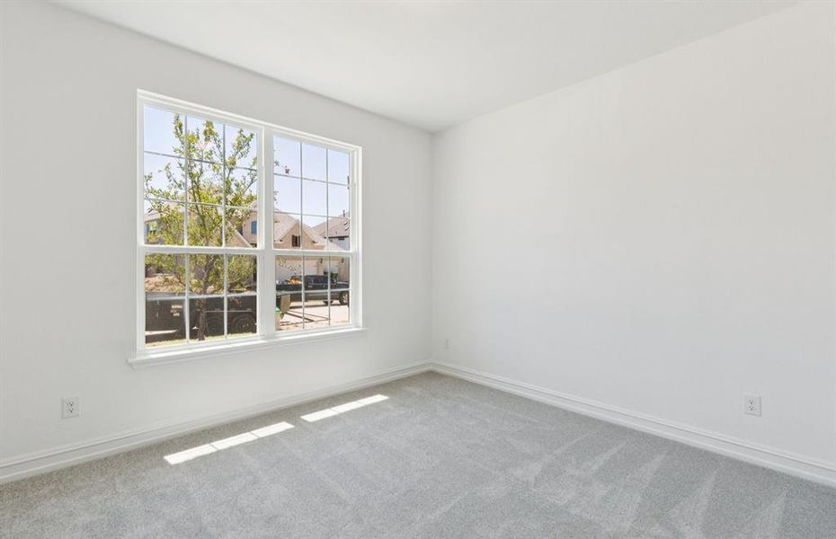 Spacious secondary bedroom*real home pictured