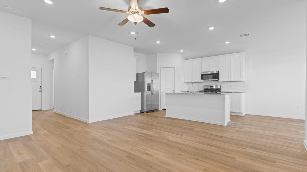 Representative unfurnished interior of a home built from the Bellvue by D.R. Horton in Marlow Lake, Texas City (Image 13).