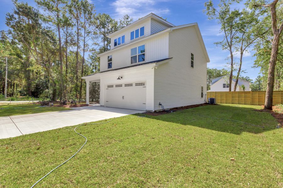 Exterior details and patio area of a home in , Awendaw (Image 20).