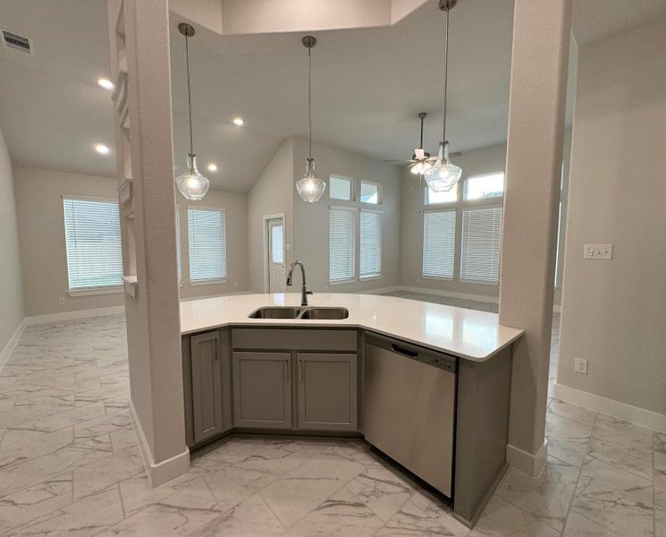 Kitchen looking out to main living and dining areas