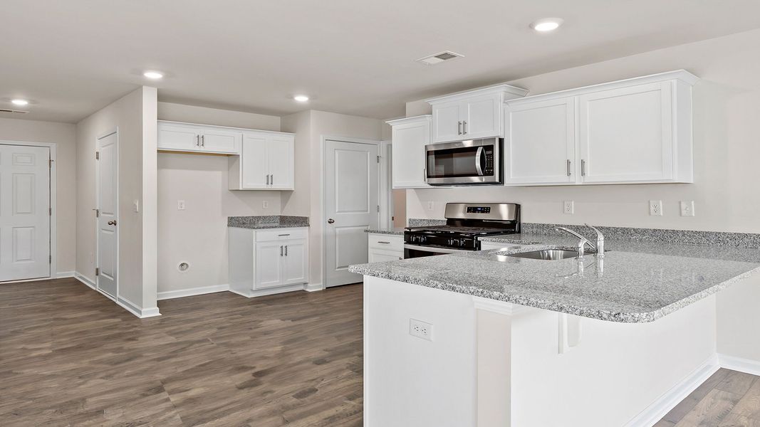 Furnished interior view inside a new home in Bentley Park, Greenwood (Image 10).
