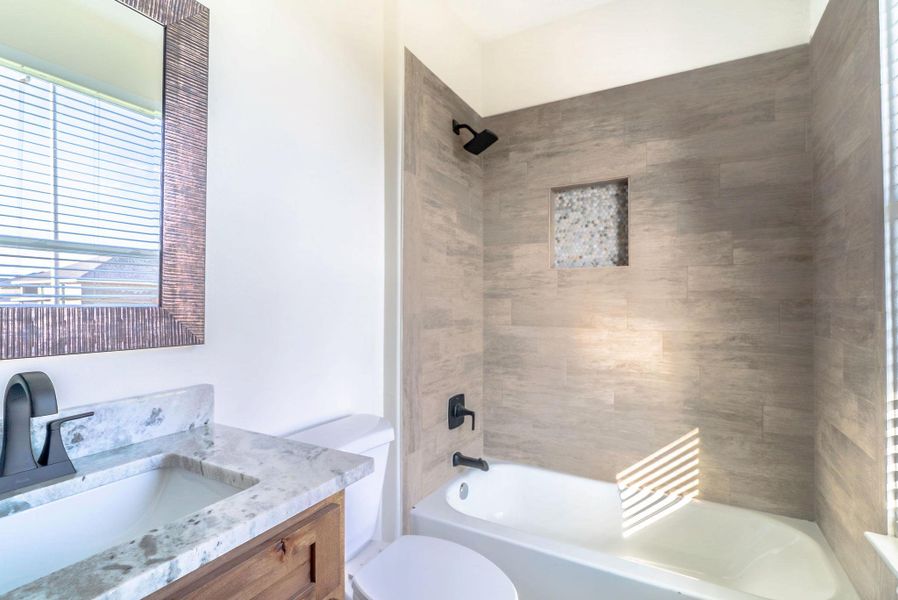 Full bathroom with vanity and tub / shower combination Full bathroom with vanity and tub / shower combination