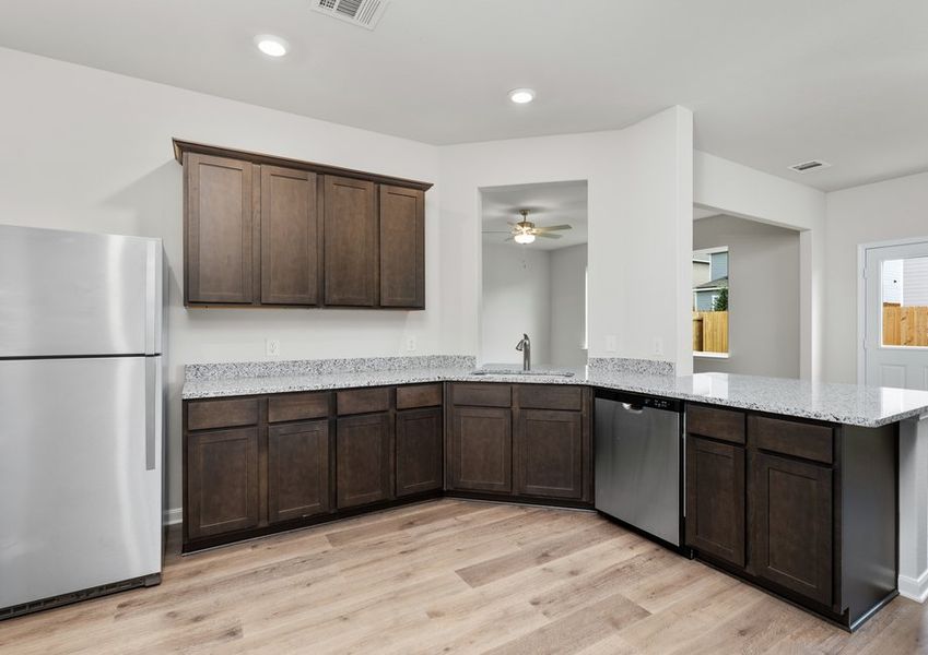 The kitchen has a Moen faucet with a pullout nozzle. The kitchen has a Moen faucet with a pullout nozzle.