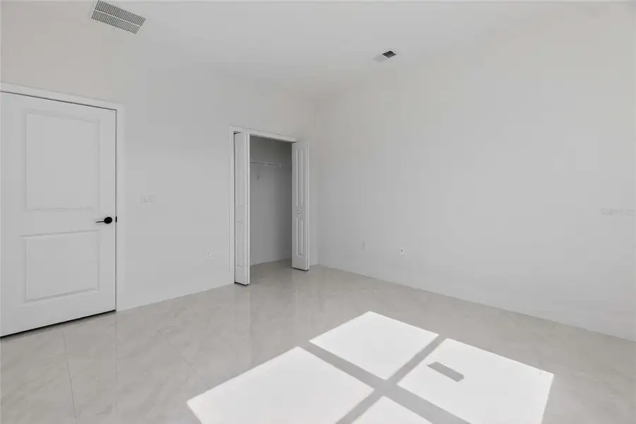 Spacious, unfurnished interior of a new home in , Port Charlotte (Image 59).