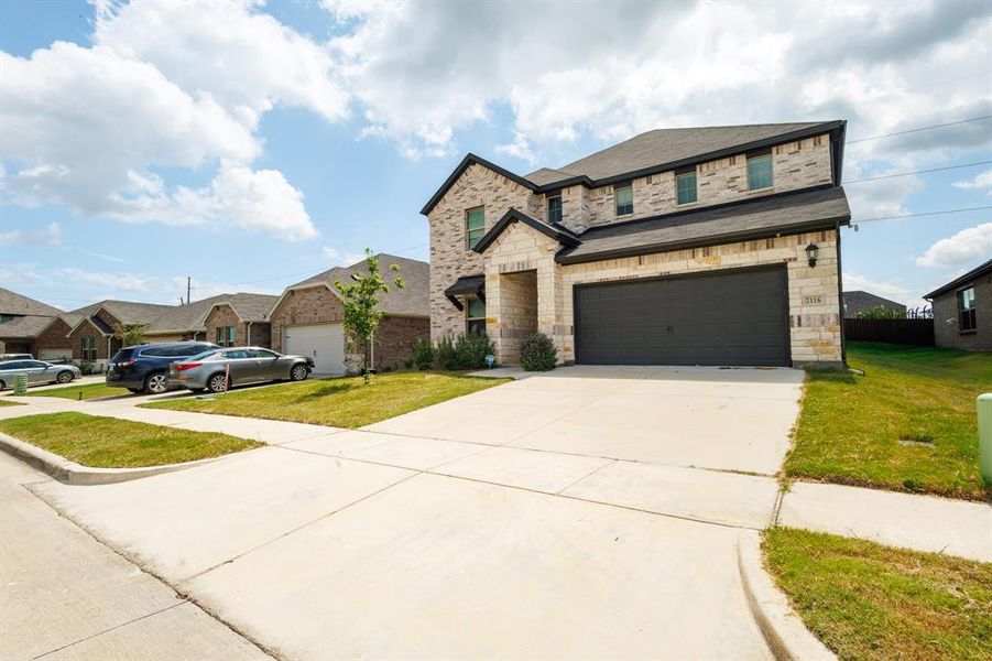Front exterior of a new home in Stonehaven, Seagoville, TX, highlighting curb appeal (Image 1). Front exterior of a new home in Stonehaven, Seagoville, TX, highlighting curb appeal (Image 1).