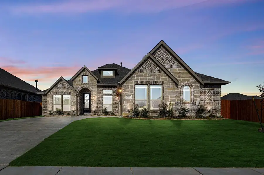 Front exterior of a new home in Mockingbird Heights Classic 60, Midlothian, TX, highlighting curb appeal (Image 2).