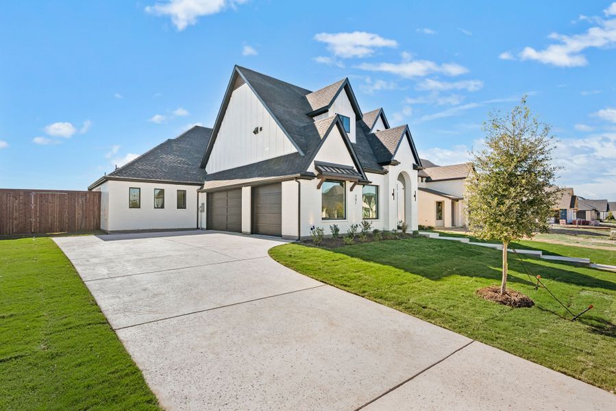 Front exterior of a new home in NorthGlen, Haslet, TX, highlighting curb appeal (Image 27).