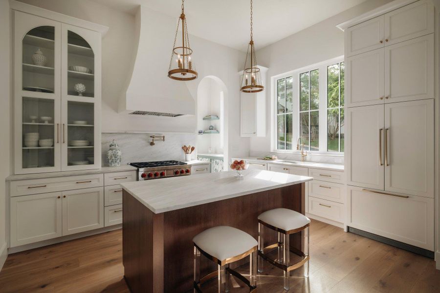 Large windows over kitchen sink. Paneled refrigerator. Quartz counters and designer fixtures.