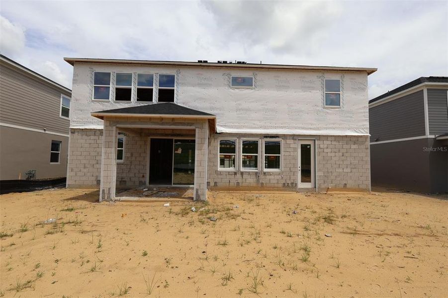 Exterior details and patio area of a home in Emerson Pointe, Apopka (Image 2).