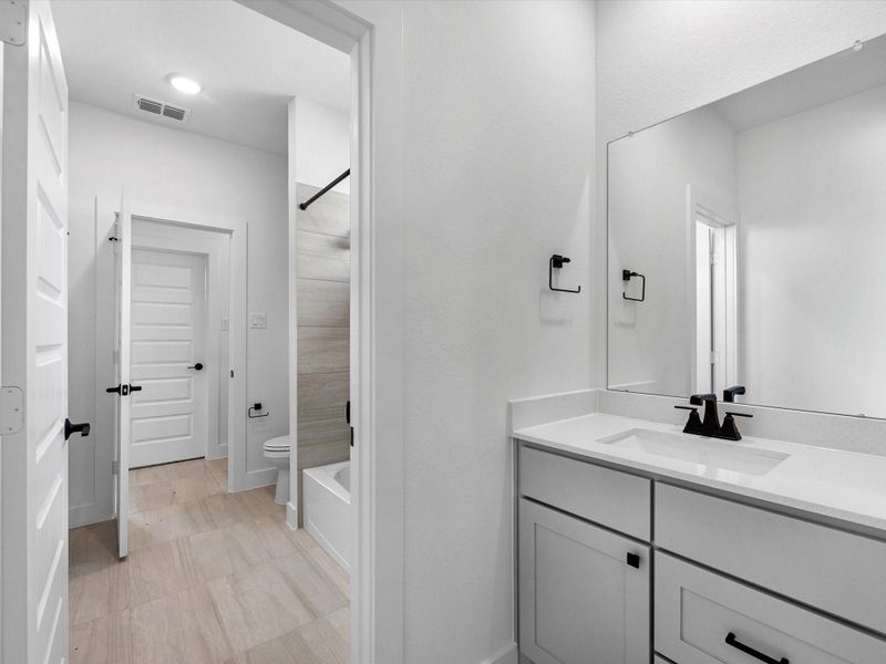Furnished interior view inside a new home in Harvest Green, Richmond (Image 7).