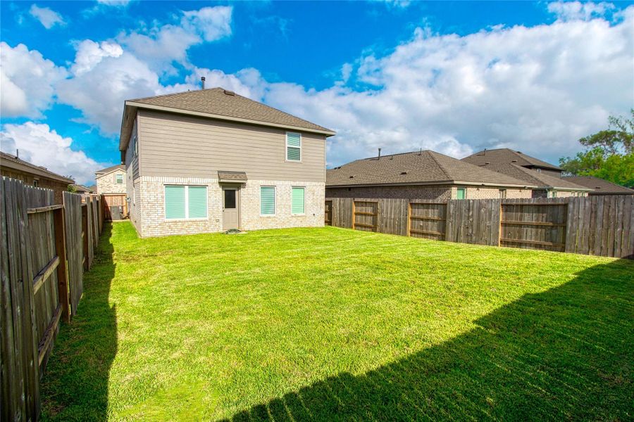 Exterior details and patio area of a home in Sunterra, Katy (Image 4).