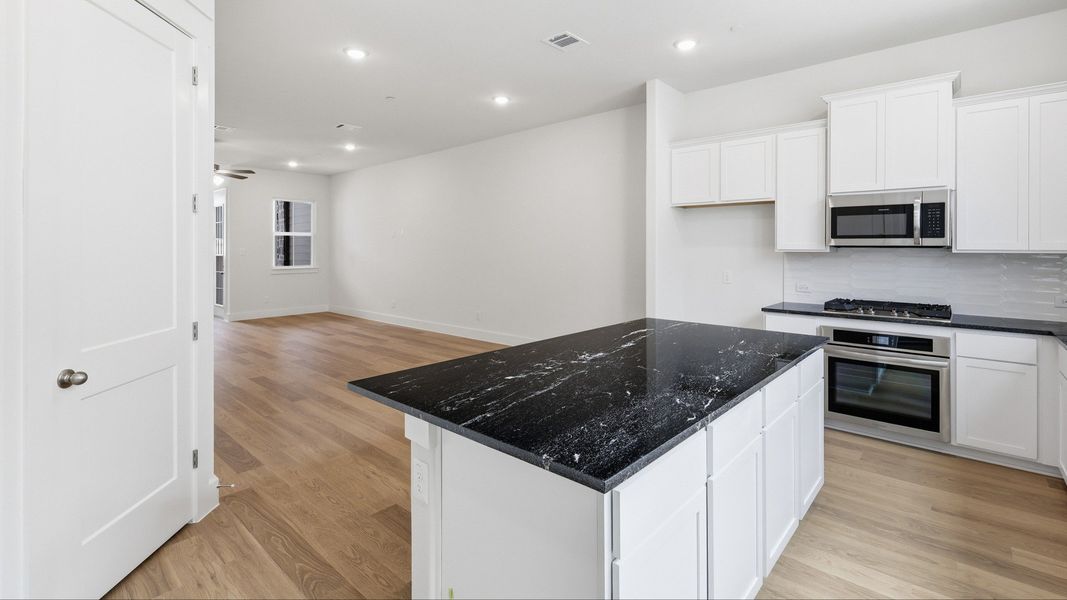 Furnished interior view inside a new home in Collin Creek, Plano (Image 29).