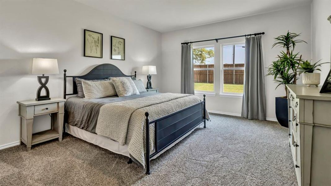 Spacious room featuring neutral carpeting and white walls Spacious room featuring neutral carpeting and white walls