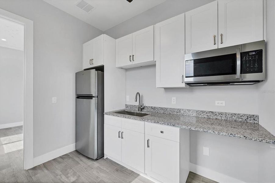 Furnished interior view inside a new home in , Port Charlotte (Image 9).