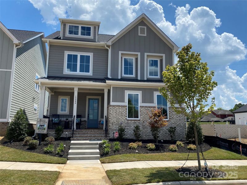 Front exterior of a new home in , Davidson, NC, highlighting curb appeal (Image 1). Front exterior of a new home in , Davidson, NC, highlighting curb appeal (Image 1).