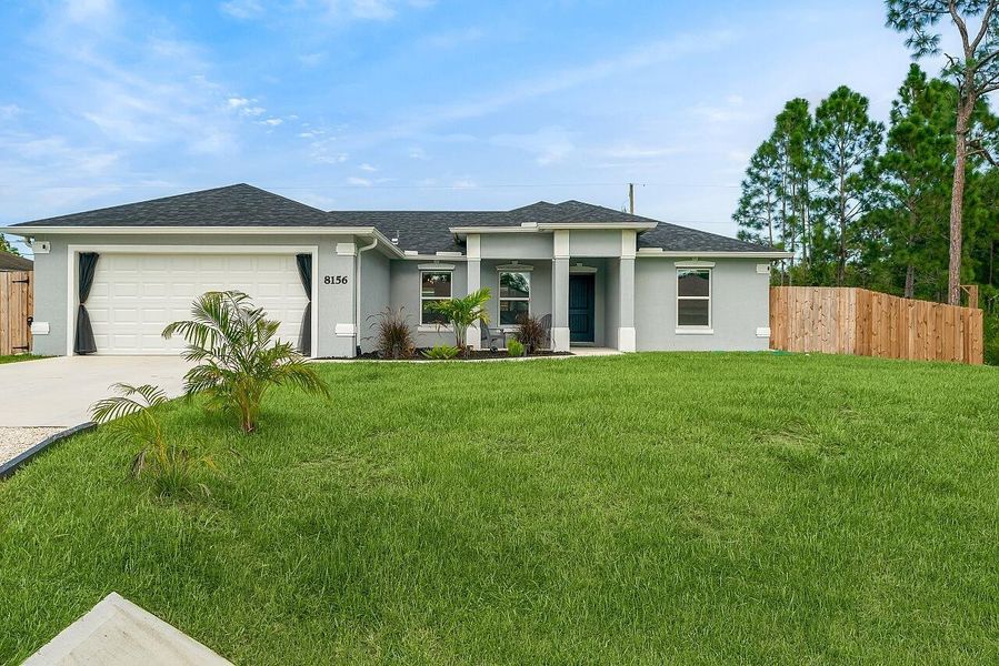 Front exterior of a new home in , Vero Beach, FL, highlighting curb appeal (Image 2). Front exterior of a new home in , Vero Beach, FL, highlighting curb appeal (Image 2).
