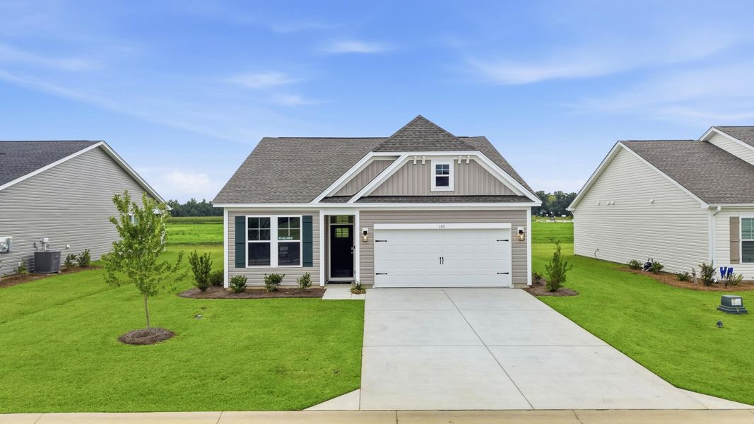 Front exterior of a new home in Edgefield, Loris, SC, highlighting curb appeal (Image 17). Front exterior of a new home in Edgefield, Loris, SC, highlighting curb appeal (Image 17).