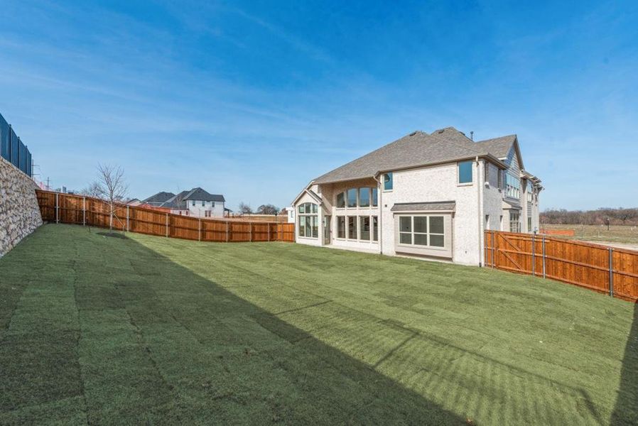 Exterior details and patio area of a home in Chatham Reserve, Providence Village (Image 4).