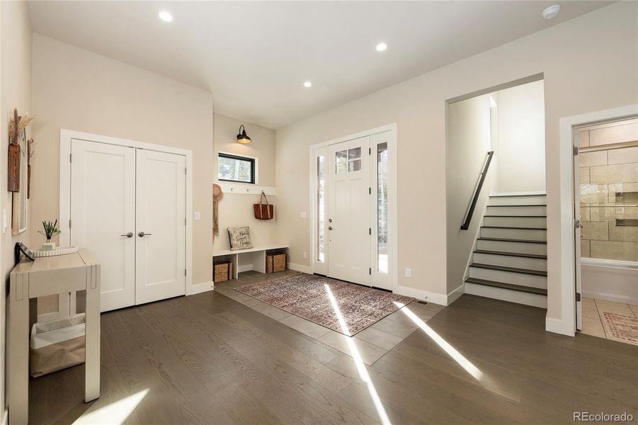 Walk upstairs to the primary bedroom suite