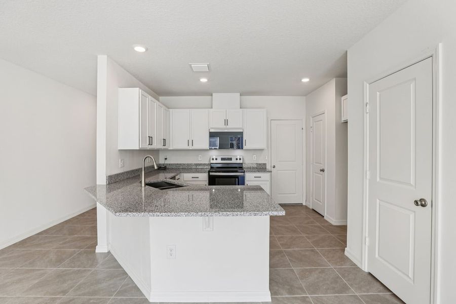 Furnished interior view inside a new home in Reserve at Forest Lake Townhomes, Lake Wales (Image 7).
