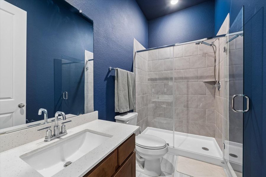 Well-appointed second bathroom with clean, modern finishes. Well-appointed second bathroom with clean, modern finishes.