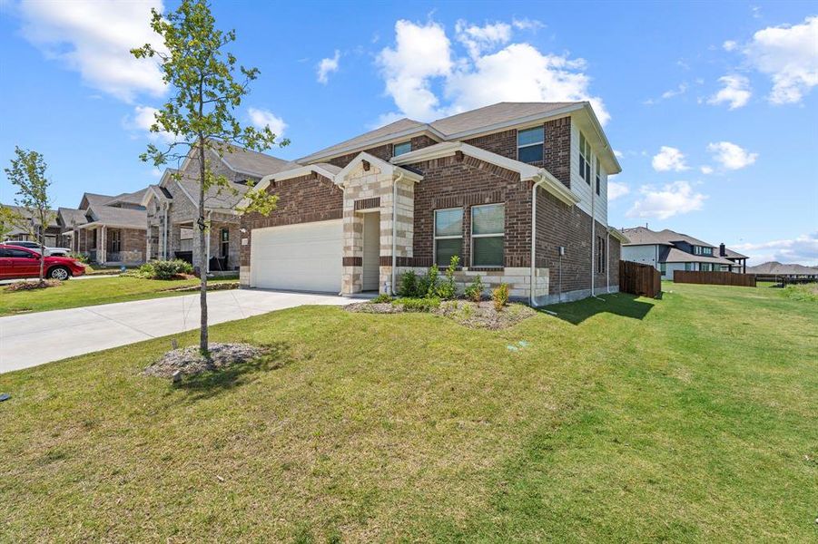 Front exterior of a new home in Briarwood Hills - Highland Series, Forney, TX, highlighting curb appeal (Image 22). Front exterior of a new home in Briarwood Hills - Highland Series, Forney, TX, highlighting curb appeal (Image 22).