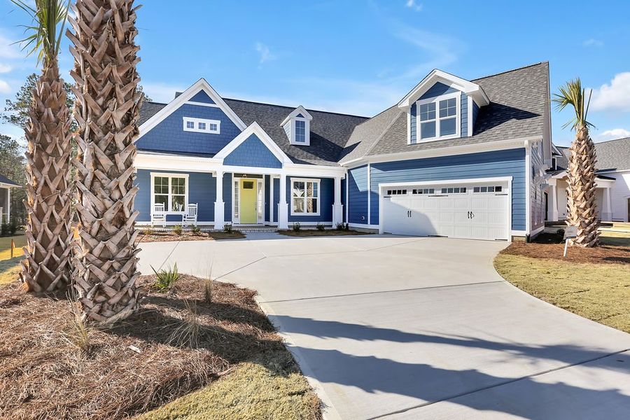Front exterior of a new home in Compass Pointe, Leland, NC, highlighting curb appeal (Image 2). Front exterior of a new home in Compass Pointe, Leland, NC, highlighting curb appeal (Image 2).