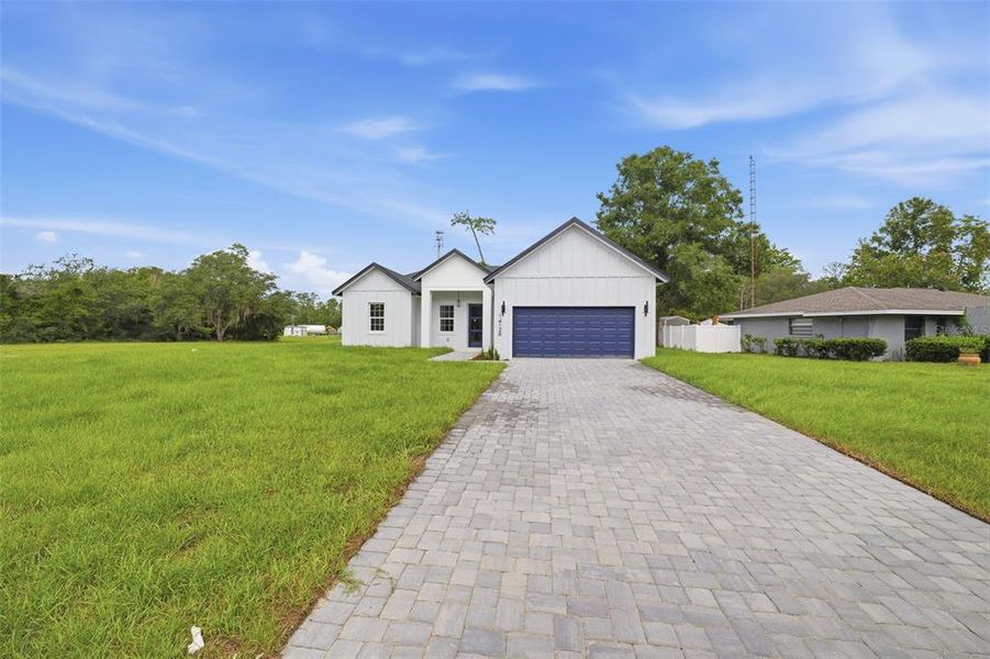 Front exterior of a new home in , Ocala, FL, highlighting curb appeal (Image 22).