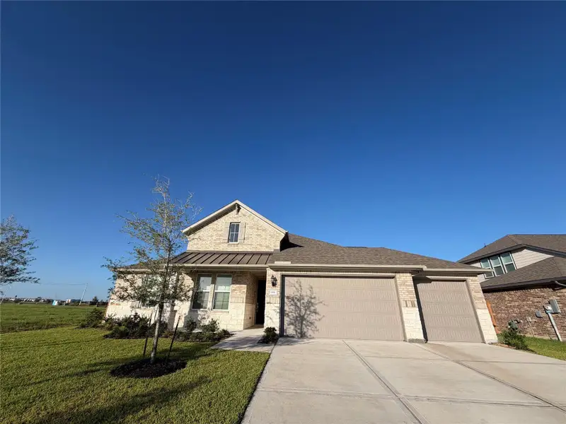 Front exterior of a new home in , Texas City, TX, highlighting curb appeal (Image 1). Front exterior of a new home in , Texas City, TX, highlighting curb appeal (Image 1).