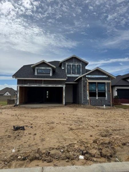 Front exterior of a new home in Bridgeland 45', 50', 70', Cypress, TX, highlighting curb appeal (Image 2). Front exterior of a new home in Bridgeland 45', 50', 70', Cypress, TX, highlighting curb appeal (Image 2).