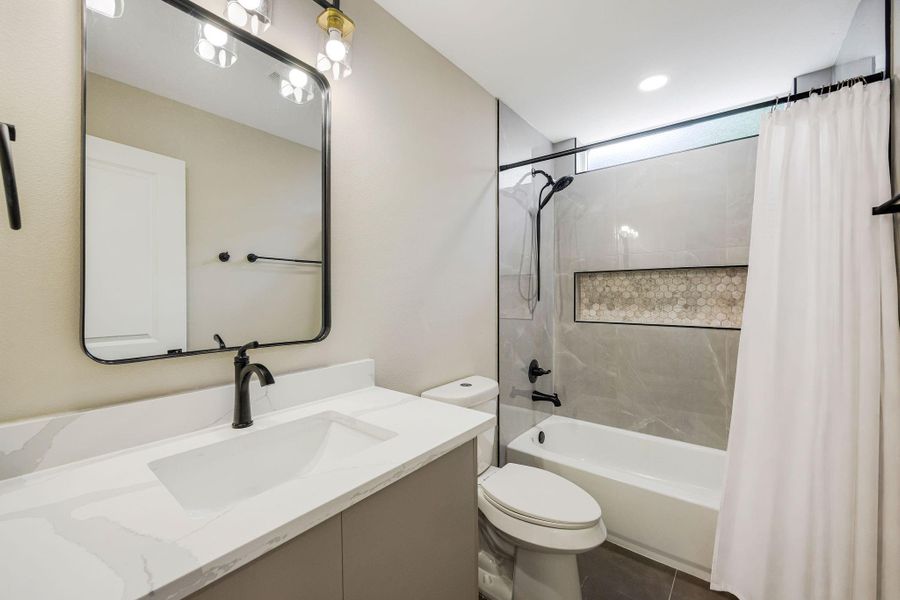 Well-appointed secondary bathroom with modern fixtures and a tub/shower combination. Well-appointed secondary bathroom with modern fixtures and a tub/shower combination.